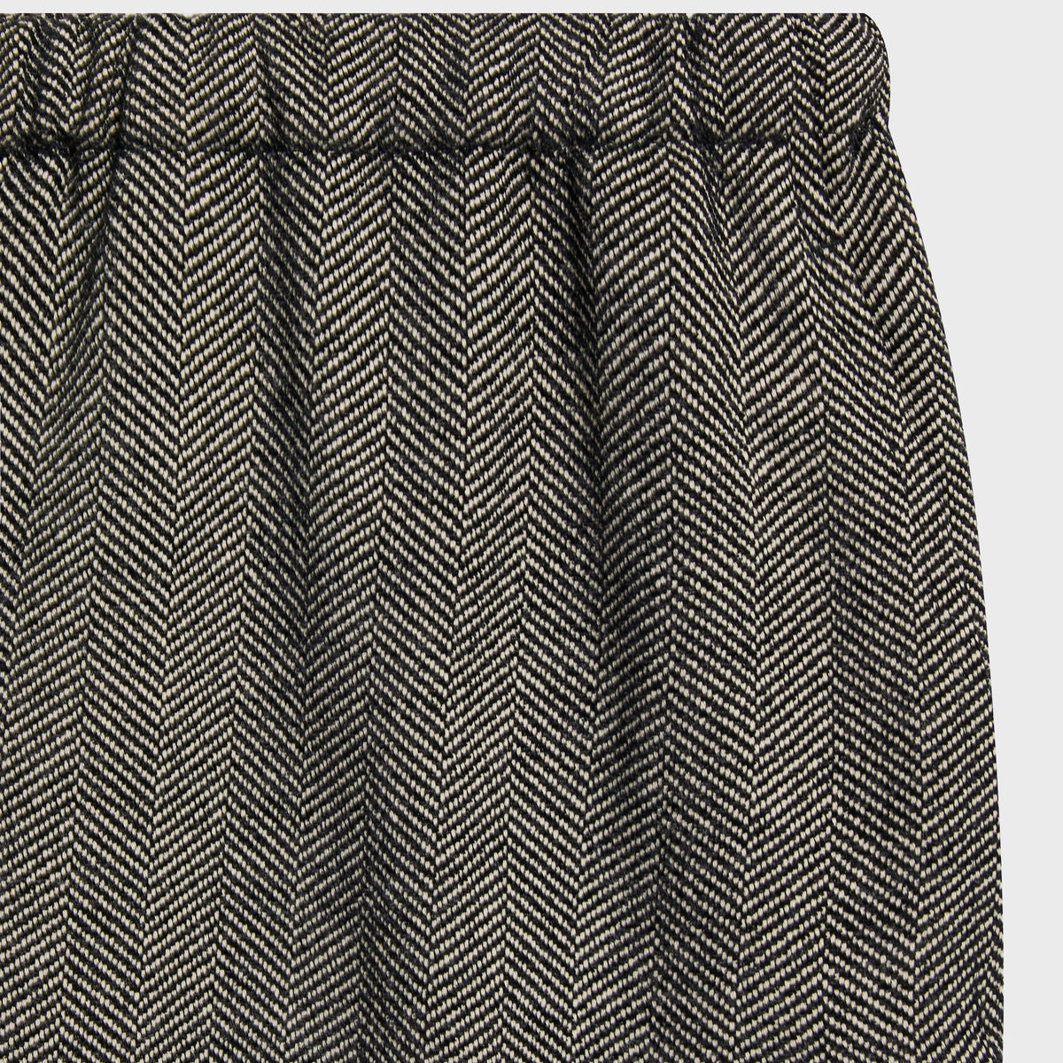 Close-up of the herringbone waistband on the Kith Chenille Grayson pant